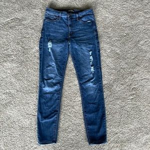 J. Crew blue jeans with a couple holes